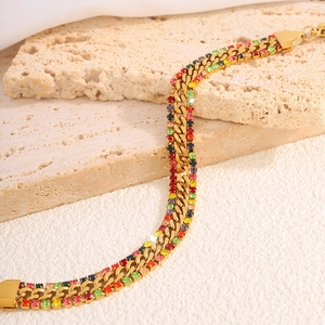 Detail of 18k gold plated Cuban chain bracelet with colorful pavé cubic zirconia stones