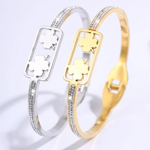 Titaniumstalen C-vormige klaverarmbanden met zirkonia in goud- en zilverkleurige afwerking