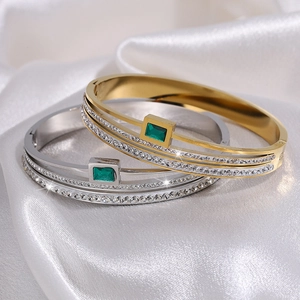 Three-layer titanium steel bracelet with emerald cut green stone and white crystals