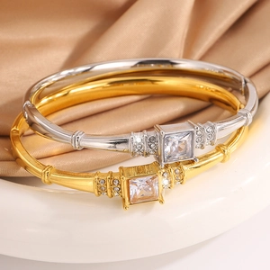 Elegant gold and silver titanium steel bracelets set with large square-cut zirconia