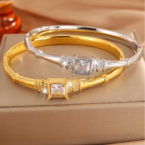 Titanium steel couple bracelets with square diamond inlay in gold and silver finish