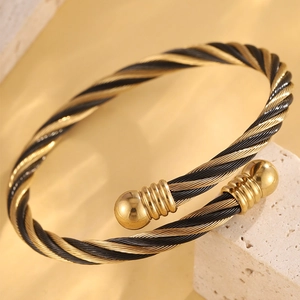 Bracelet jonc torsadé en acier inoxydable bicolore noir et or avec embouts sphériques