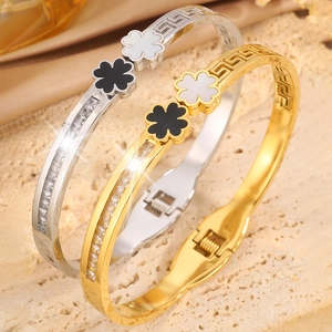 Four-leaf clover titanium steel open bangle with Greek fret and sparkling zircons