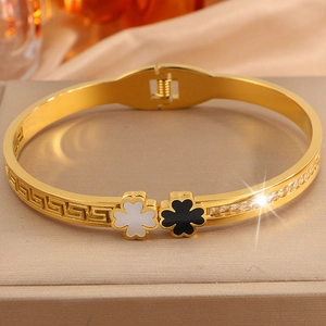 Detail of clover bangle with Greek fret pattern and sparkling zircon inlay