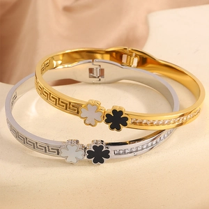 Clover stainless steel bangles in gold and silver with Greek fret and cubic zirconia