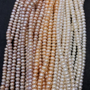 Detail of natural freshwater abacus pearls in white, pink and lavender for DIY jewelry