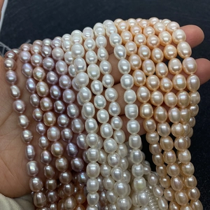 Detailed view of assorted natural rice-shaped pearls in lavender, white, and champagne pink