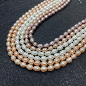 Macro detail of multicolored 4-9mm AAA grade rice shaped freshwater pearls for jewelry making