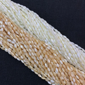 Cuentas de concha natural en forma de arroz con brillo iridiscente para joyas DIY