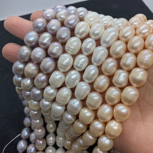 Macro shot of natural baroque freshwater pearls in white, purple, and champagne colors