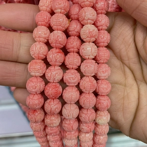 Pink synthetic coral beads with traditional longevity carvings for DIY jewelry making
