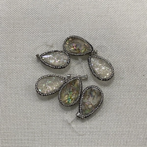 Waterdrop-shaped abalone shell and crystal pendant with sparkling stone borders