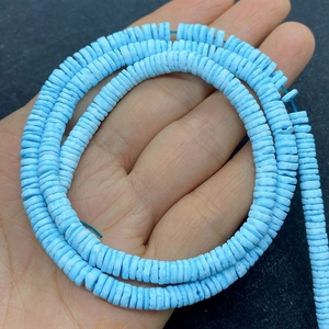 Detail of 5-8mm dyed light blue disc heishi beads for DIY jewelry making and bracelet crafts