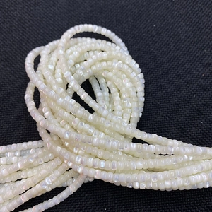 Macro shot of 3-7mm natural white mother of pearl seed beads for DIY jewelry