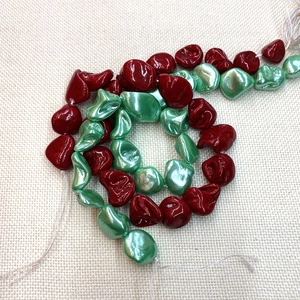 Irregular natural shell beads in deep red and mint green for DIY necklace making