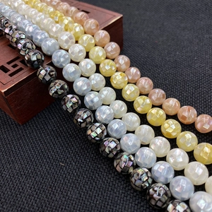 Macro view of multi-faceted mother of pearl beads in vibrant colors for jewelry making