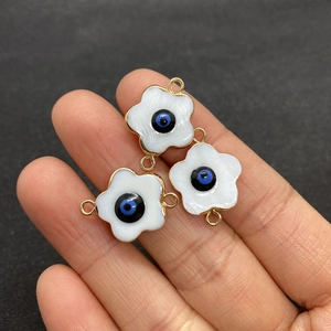 Golden flower evil eye connectors with natural white shell petals for DIY jewelry making