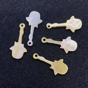 Five natural sea shell guitar shaped pendants with iridescent finish and pre-drilled holes