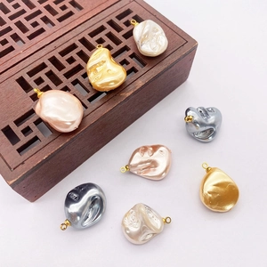 Irregular Baroque pearl pendants with golden metal rings in various pearlescent colors