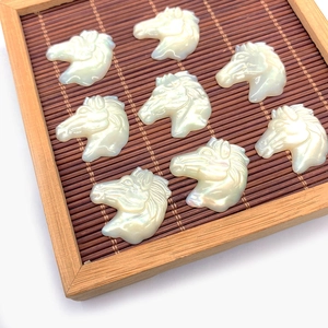 Set of eight carved white mother of pearl horse head pendants for DIY jewelry making