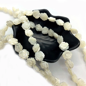 Strand of 8mm white carved shell rose beads with iridescent luster for DIY jewelry