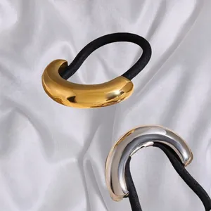 Minimalist gold and silver stainless steel hair ties with sleek C-shaped metal accents