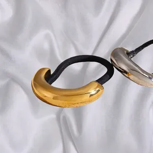Minimalist gold and silver metallic ponytail holders with sleek polished finish