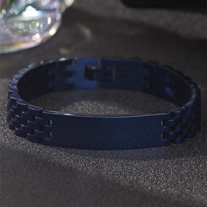 Detail of dark blue stainless steel link bracelet with engravable blank metal plate