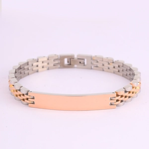 Detail of silver and rose gold bicolor watch-style bracelet with a blank polished nameplate