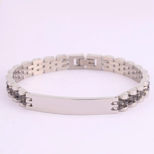 Macro detail of silver stainless steel watch-style bracelet with flat metal nameplate