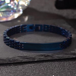 Macro shot of navy blue stainless steel ID bracelet with flat engravable surface on stone