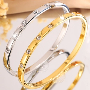 Polished titanium steel bracelets in gold and silver set with sparkling zircons