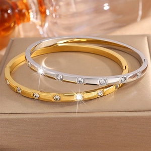 Polished titanium steel bangles in gold and silver finish with zircon diamond inlay
