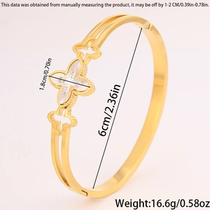 Detail shot of gold four-leaf clover bangle with pearl inlay and size specifications