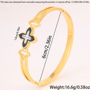 Detail view of gold clover bangle showing 1.8cm ornament and 6cm diameter size specs
