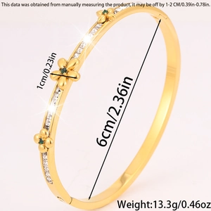 Detail view of gold floral bangle with dimensions 6cm diameter and 13.3g weight