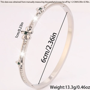 Detailed size view of silver camellia bracelet with green stones and pavé diamonds