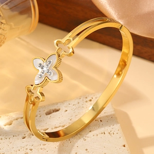 Luxurious gold stainless steel four-leaf clover bracelet with white mother-of-pearl and diamonds