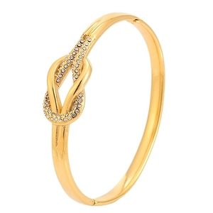 Elegante brazalete de nudo en acero inoxidable chapado en oro 18k con cristales finos