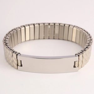 Close-up of polished stainless steel elastic watch band with a flat engraving plate
