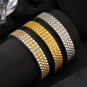 Elastic stainless steel watch band bracelets in gold and silver finish on display