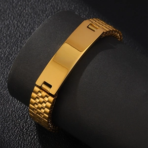 Detailed view of golden stainless steel watch-style bracelet with blank ID plate on stand