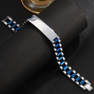 Detail of silver and blue stainless steel link bracelet with polished metal engravable bar