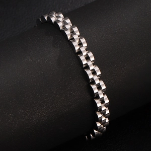 Detailed close-up of 3-link stainless steel watch strap on a black display stand