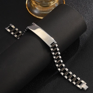 Macro shot of two-tone stainless steel ID bracelet with adjustable watch band links