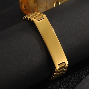 Detailed close-up of a 12mm golden stainless steel men's ID bracelet on a black stand