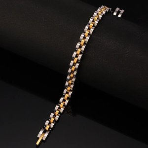 Macro shot of two-tone stainless steel watch-style bracelet on black stand