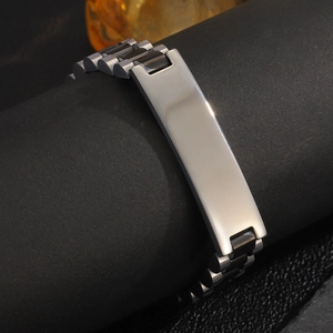 Detail view of two-tone stainless steel link bracelet with silver plate on black stand