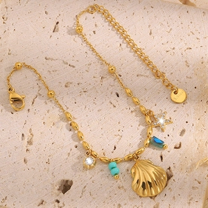 Bracelet doré en acier inoxydable avec pendentif coquillage et étoile sur pierre