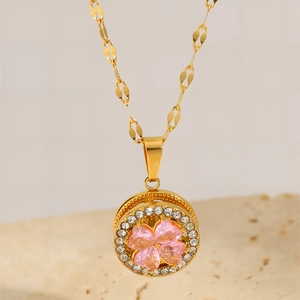 Elegant gold titanium clover necklace with pink crystal pendant and sparkling diamonds